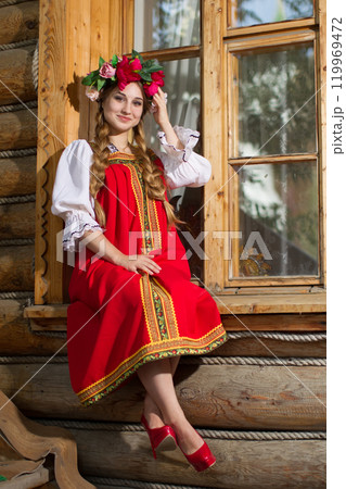 Beautiful Russian Slavic girl in national dress. 119969472