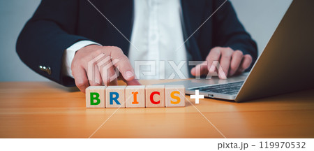 BRICS economic business international cooperation concept, Wooden cube block at print screen letters Brics represent a group of countries with rapidly developing economies. BRICS economic business international cooperation concept, Wooden cube block at print screen letters Brics represent a group of countries with rapidly developing economies. 119970532