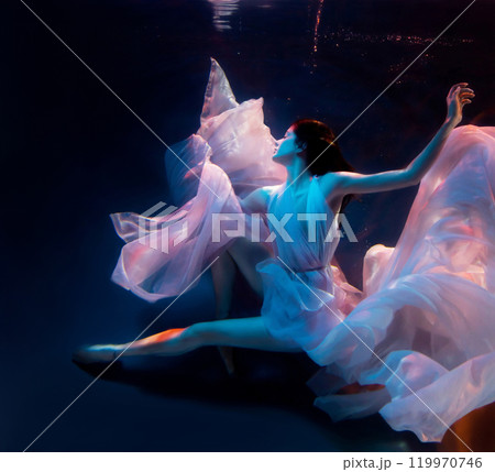Underwater woman swimming in pool. Blurred soft focus 119970746
