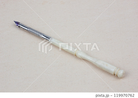 Vintage pen on paper background 119970762