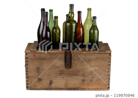 Antique retro green glass bottles on wooden box 119970846