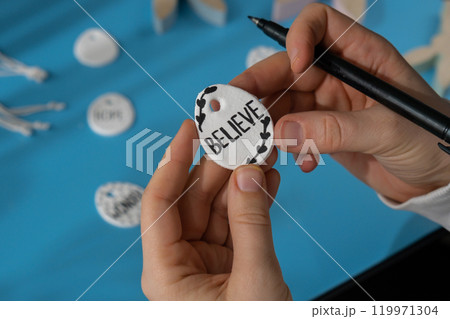 Workshop writing word BELIEVE on EASTER clay egg Children air dry clay activity handicraft idea. DIY process step by step instruction. Preparing for Easter holiday decorating. Modern organic design Workshop writing word BELIEVE on EASTER clay egg Children air dry clay activity handicraft idea. DIY process step by step instruction. Preparing for Easter holiday decorating. Modern organic design 119971304