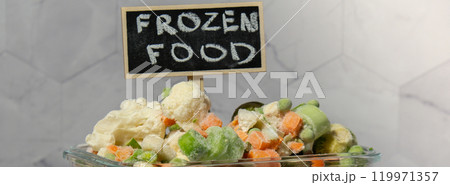 Frozen mixed vegetables for long-term storage with blackboard label and text FROZEN FOOD. Deep freezing of vegetables. defrosting Frozen food background Frozen mixed vegetables for long-term storage with blackboard label and text FROZEN FOOD. Deep freezing of vegetables. defrosting Frozen food background 119971357