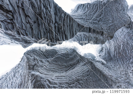 Ice cave with rock formation of water eroded on winter Ice cave with rock formation of water eroded on winter 119971593