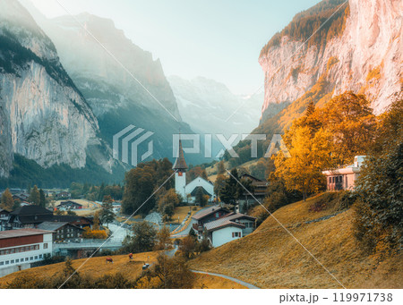 Lauterbrunnen valley with rustic village, famous church in autumn at Switzerland Lauterbrunnen valley with rustic village, famous church in autumn at Switzerland 119971738