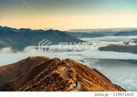 Landscape of Roys Peak summit with foggy mountain and tourist enjoying in autumn at New Zealand 119971820