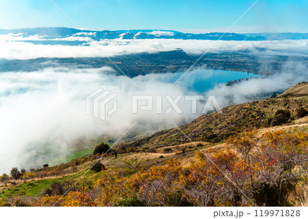 Scenic foggy mountain view from summit of Roys Peak and Lake Wanaka in autumn at New Zealand 119971828