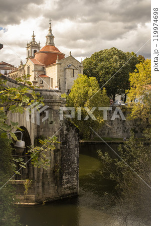 View of the river, ancient stone bridge and church in the city of Amarante in Portugal View of the river, ancient stone bridge and church in the city of Amarante in Portugal 119974698
