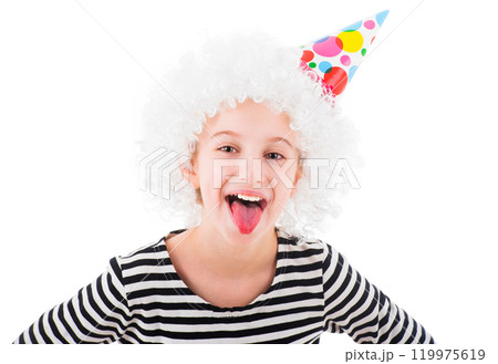 Teenage girl in white clown wig and party cone hat showing tongue isolated on white background 119975619