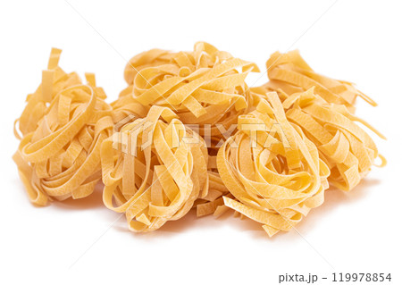 A Pile of Classic Italian Raw Egg Fettuccine - Isolated on White Background A Pile of Classic Italian Raw Egg Fettuccine - Isolated on White Background 119978854