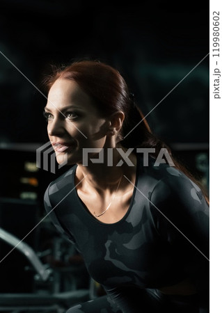 Slim fitness trainer in sportswear view 119980602