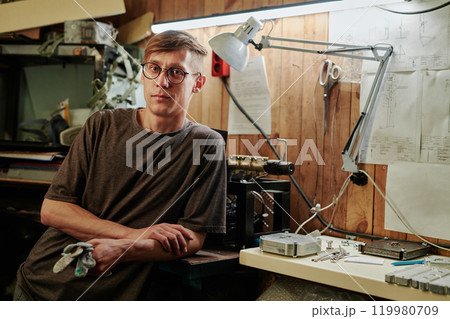 Technician in eyeglasses and t-shirt Technician in eyeglasses and t-shirt 119980709