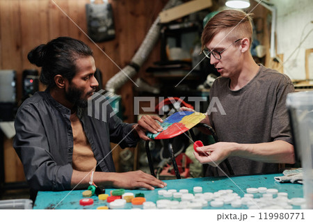 Young worker touching plastic stool seat Young worker touching plastic stool seat 119980771