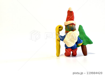 Santa Claus leaves with a Christmas tree and a staff. 119984420