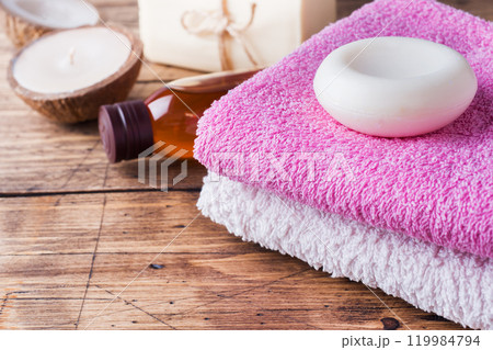 Spa and Wellness concept on wooden background. Soap and Terry towel. Spa and Wellness concept on wooden background. Soap and Terry towel. 119984794