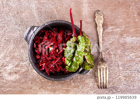 Beetroot salad with wallnuts and garlic in bowl Beetroot salad with wallnuts and garlic in bowl 119985639