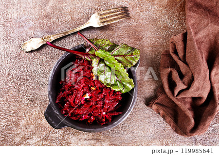 Beetroot salad with wallnuts and garlic in bowl Beetroot salad with wallnuts and garlic in bowl 119985641