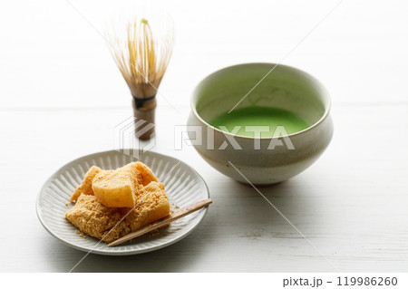 Cup of fresh matcha tea on white wooden table. Cup of fresh matcha tea on white wooden table. 119986260