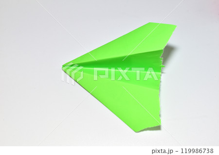 Green paper airplane. Green paper airplane. 119986738
