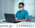 Doctor Working on Laptop 119986822