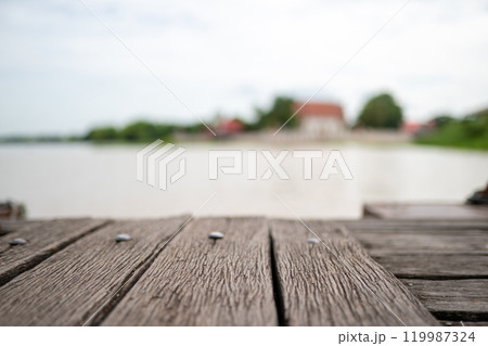 close up vintage old wood plate at pier with river background. 119987324