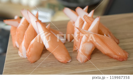 Crab stick sashimi, Japanese food on wood plate. Sliced Japanese food crab stick sashimi display for photo shooting. 119987358