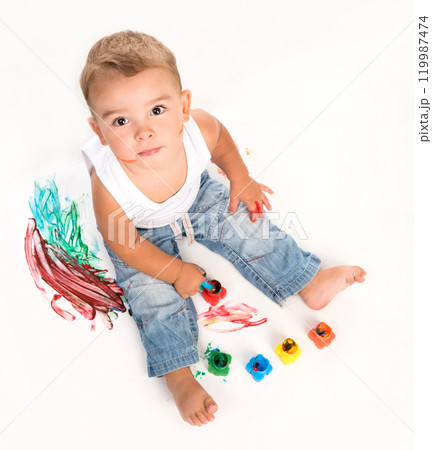 cute little boy and gouache above photo on white background cute little boy and gouache above photo on white background 119987474