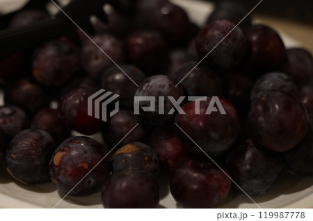 A Vibrant and Fresh Plate of Juicy Purple Plums Perfect for Summer Enjoyment and Delight A Vibrant and Fresh Plate of Juicy Purple Plums Perfect for Summer Enjoyment and Delight 119987778