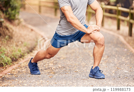Man, stretching leg and ready for exercise in outdoor, fitness and preparation for running. Male person, athlete and warm up for workout in park or nature, flexible and muscle relief for training 119988173