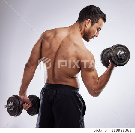 Man, dumbbell and body in studio for workout, muscle and fitness on white background with bicep. Athlete, gym and training for sports, exercise and wellness as bodybuilder with power or weights 119988363