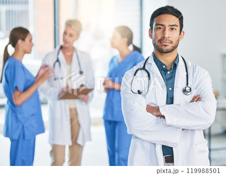 Man, doctor and portrait with arms crossed in hospital, clinic and leadership of surgery team. Cardiology, surgeon and consulting with person with trust in expert, service and healthcare management 119988501