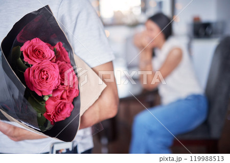 Hope, couple and man with flowers as surprise, anniversary celebration and romance in marriage. Home, married people and husband with red roses, floral and romantic gesture for happy wife with love Hope, couple and man with flowers as surprise, anniversary celebration and romance in marriage. Home, married people and husband with red roses, floral and romantic gesture for happy wife with love 119988513