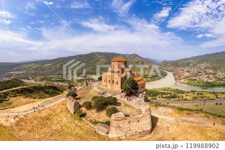 Aerial top view of ancient Jvari Monastery is a VI century Georgian Orthodox monastery. Holy Cross church is Early Medieval Georgian. Confluence of Kura and Aragvi. Tbilisi, Mtskheta, Georgia, Europe. Aerial top view of ancient Jvari Monastery is a VI century Georgian Orthodox monastery. Holy Cross church is Early Medieval Georgian. Confluence of Kura and Aragvi. Tbilisi, Mtskheta, Georgia, Europe. 119988902
