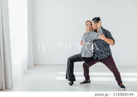 Man and woman dancing together to bachata music 119989149