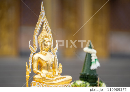 A stunning golden Buddha sculpture, exemplifying the deep reverence and devotion of Thai individuals in their spiritual worship. 119989375