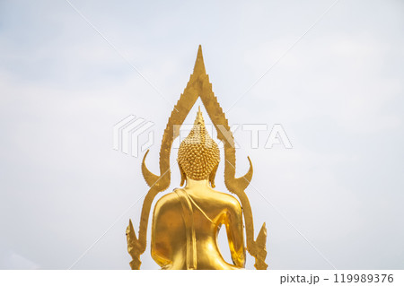 A stunning golden Buddha sculpture, exemplifying the deep reverence and devotion of Thai individuals in their spiritual worship. A stunning golden Buddha sculpture, exemplifying the deep reverence and devotion of Thai individuals in their spiritual worship. 119989376