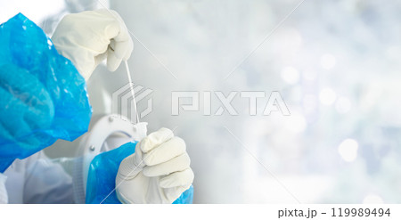 Close up to the rubber gloves on the asian medical staff is processing coronavirus or covid-19 test in the negative room pressure. Close up to the rubber gloves on the asian medical staff is processing coronavirus or covid-19 test in the negative room pressure. 119989494