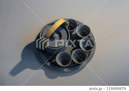TeaPot ceramic set with New contemporary Modern and Vintage combination style on flat stone kitchen counter with sunlight from window. TeaPot ceramic set with New contemporary Modern and Vintage combination style on flat stone kitchen counter with sunlight from window. 119989879