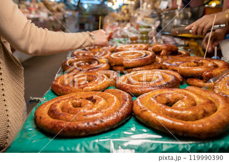 Sai Aua, Northern Thailand Spicy Sausage is a famous Traditional Local saurage cooked with curry and herb, lay on shop and ready for sales. Sai Aua, Northern Thailand Spicy Sausage is a famous Traditional Local saurage cooked with curry and herb, lay on shop and ready for sales. 119990390