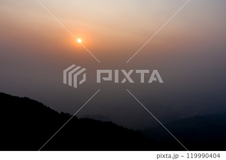 PM 2.5 in Sunrise view with the mountain foreground at Chiang Rai province, North of Thailand on 25 Mar 2021 morning 7.00 am. 119990404