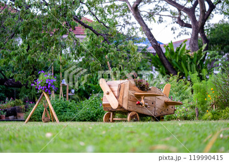 Wood plane decoration in the garden. 119990415