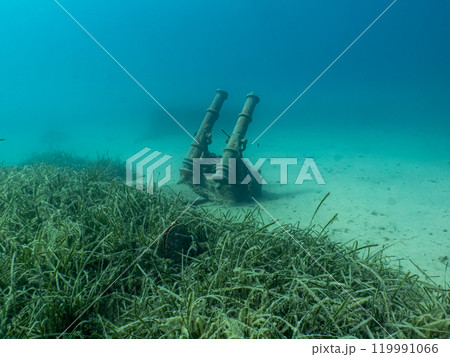 Two old cannons as a part of an artificial reef in the Adriatic Sea. Beautiful turquoise water Two old cannons as a part of an artificial reef in the Adriatic Sea. Beautiful turquoise water 119991066