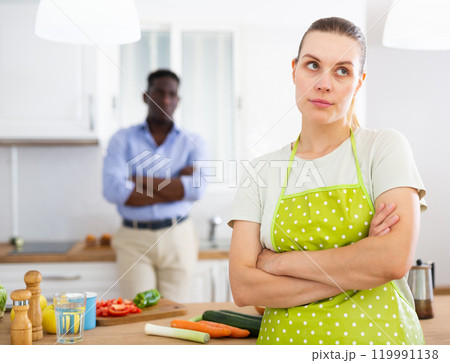 Wife is unhappy with her husband. Family quarrel in kitchen Wife is unhappy with her husband. Family quarrel in kitchen 119991138