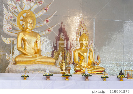 A stunning golden Buddha sculpture, exemplifying the deep reverence and devotion of Thai individuals in their spiritual worship. 119991873
