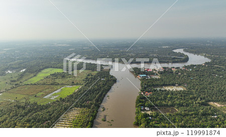 Expansive city suburbs, drenched in the warm afternoon sun, shrouded in a gentle mist with a wide, open sky. Captured the essence of the moment in January 2022. 119991874