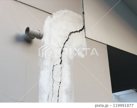 Cracked building concrete wall at the outside reveals clear fissures due to soil subsidence. This 8 year old house photo was taken on October 26, 2023. 119991877