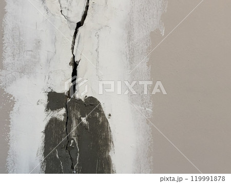 Cracked building concrete wall at the outside reveals clear fissures due to soil subsidence. This 8 year old house photo was taken on October 26, 2023. 119991878