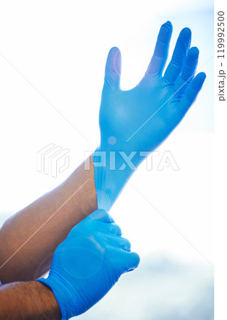 Doctor, hands and gloves for protection in healthcare with dental safety or getting ready for teeth cleaning. Dentist, professional and prepare with surgical hygiene for medical wellness or dentistry 119992500