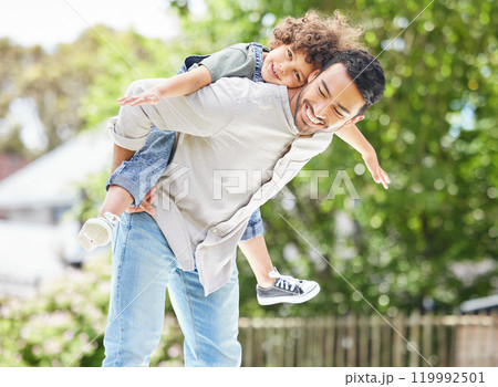 Dad, portrait and son piggyback with airplane outdoor for summer, happy and holiday as family. Man, children and smile by tree outside with care for freedom, love and fun together on fathers day 119992501