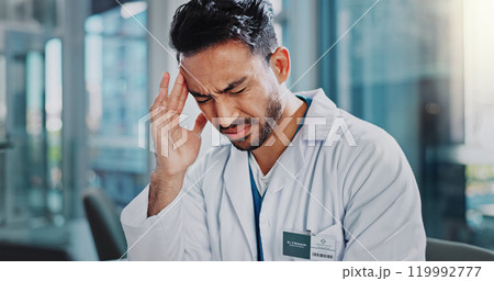 Doctor, asian man and stress with headache in clinic with anxiety, frustrated and temple massage in office. Person, pain and tired with migraine, fatigue and burnout at hospital in Indonesia Doctor, asian man and stress with headache in clinic with anxiety, frustrated and temple massage in office. Person, pain and tired with migraine, fatigue and burnout at hospital in Indonesia 119992777